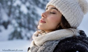 A woman experiencing dry, sensitive skin in cold weather and climate changes