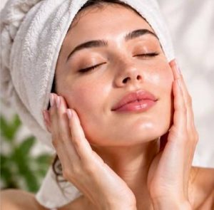 Woman touching calmer skin as a sign of skin barrier healing
